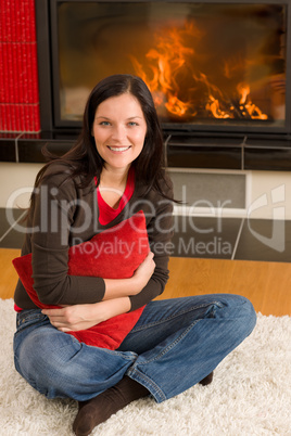 Home fireplace happy woman hold cushion