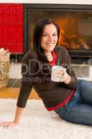 Winter home fireplace woman drink hot coffee