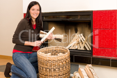 Home fireplace woman put logs happy winter