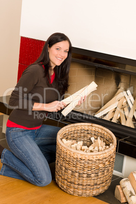 Home fireplace woman put logs happy winter