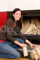 Home fireplace woman put logs happy winter