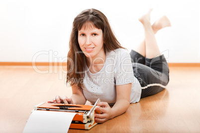 Women typing typewriter