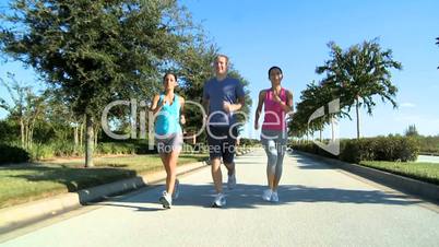 Three Young Friends Jogging Together