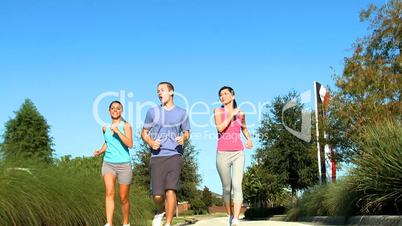 Young Running Partners on Suburban Roads