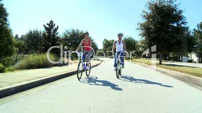 Female Friends Cycling Together