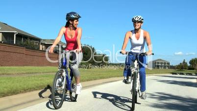 Young Females Keeping Fit and Healthy Cycling