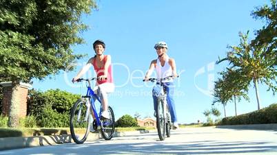 Young Females Keeping Fit and Healthy Cycling