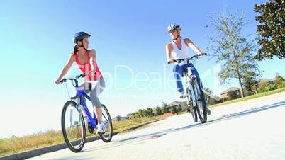 Female Friends Cycling Together