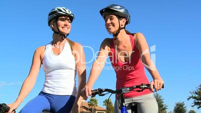 Young Females Keeping Fit and Healthy Cycling
