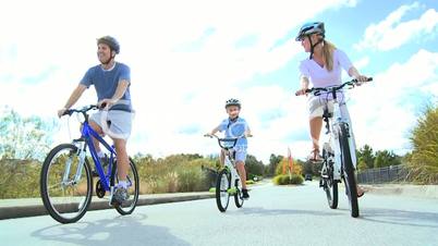 Healthy Caucasian Family Cycling Together