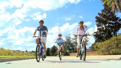 Healthy Young Family Enjoying Cycling Together
