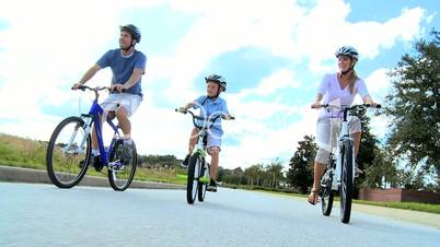 Healthy Caucasian Family Bike Riding Together