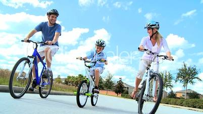 Healthy Young Family Enjoying Cycling Together