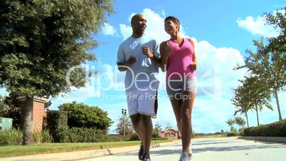 Young Couple Enjoying Jogging Exercise