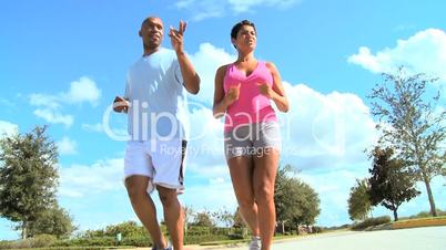 Healthy Ethnic Couple Jogging Exercise