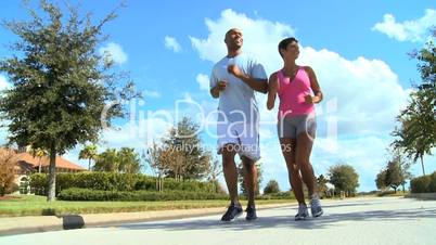 Young Running Partners on Suburban Roads