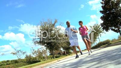 Attractive Ethnic Couple Jogging to Keep Fit