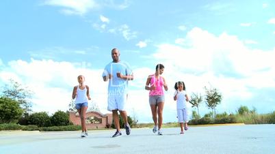 Young Ethnic Family Healthy Jogging