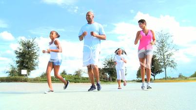 Young Ethnic Family Healthy Jogging