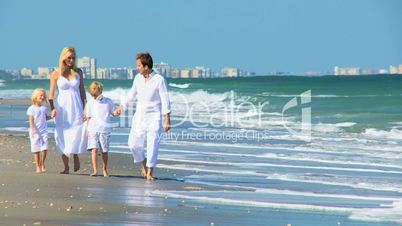 Loving Family Walking on the Beach