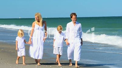 Attractive Young Family Group on Beach