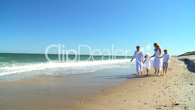Happy Caucasian Family Walking on Beach