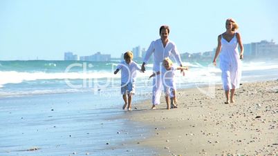 Happy Caucasian Family Enjoying Beach Vacation