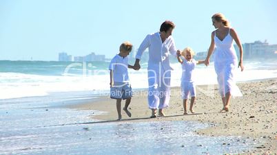 Happy Caucasian Family Enjoying Beach Vacation