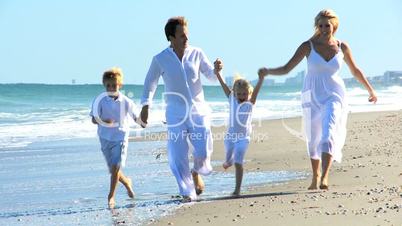 Caucasian Family Group Enjoying Beach Lifestyle