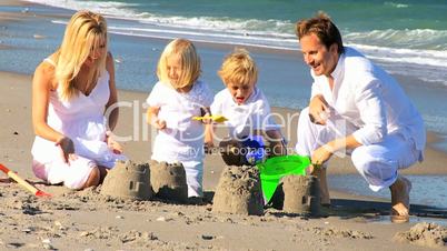 Happy Young Family Enjoying Beach Vacation