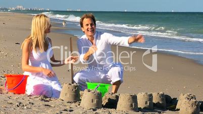 Children Running on Beach to Parents