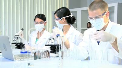 Three Assistants in Medical Research Laboratory