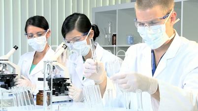 Three Junior Doctors Studying in Hospital Laboratory