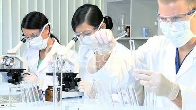 Three Research Students in Medical Laboratory