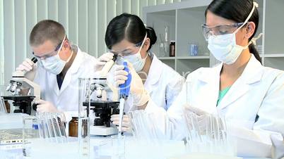 Three Students in Medical Research Laboratory