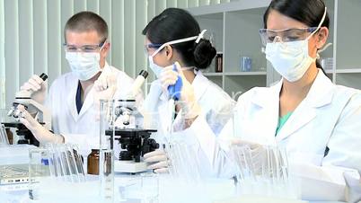 Three Students in Medical Research Laboratory