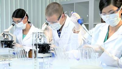 Three Student Medical Researchers in Laboratory