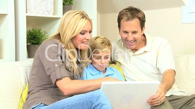 Young Family Using a Laptop Computer