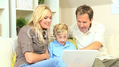 Caucasian Family Having Fun on Laptop Computer