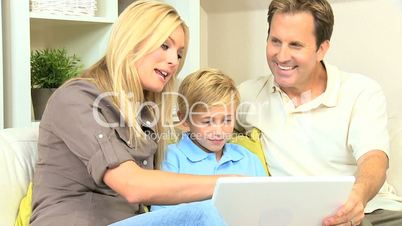 Young Blonde Boy Using Laptop