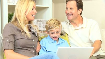 Caucasian Family With a Laptop Computer