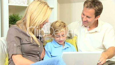 Caucasian Family Having Fun on Laptop Computer