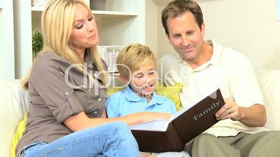 Young Caucasian Family with Photograph Album