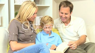 Caucasian Parents and Son Reading a Book