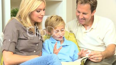 Caucasian Parents and Son Reading a Book
