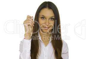 Young businesswoman writing with pen