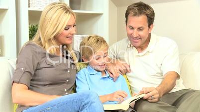 Caucasian Family Sitting with a Book
