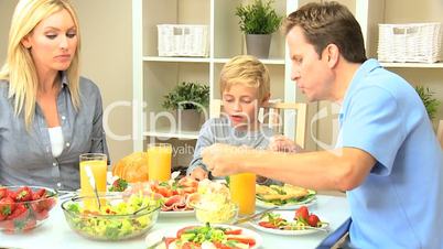 Young Family Eating Healthy Meal