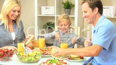 Young Family Eating Healthy Meal