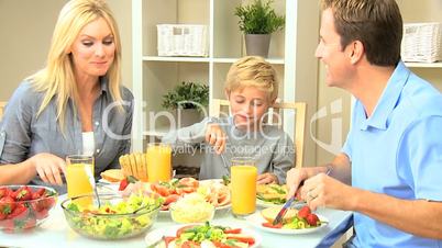 Young Family Enjoying a Healthy Meal
